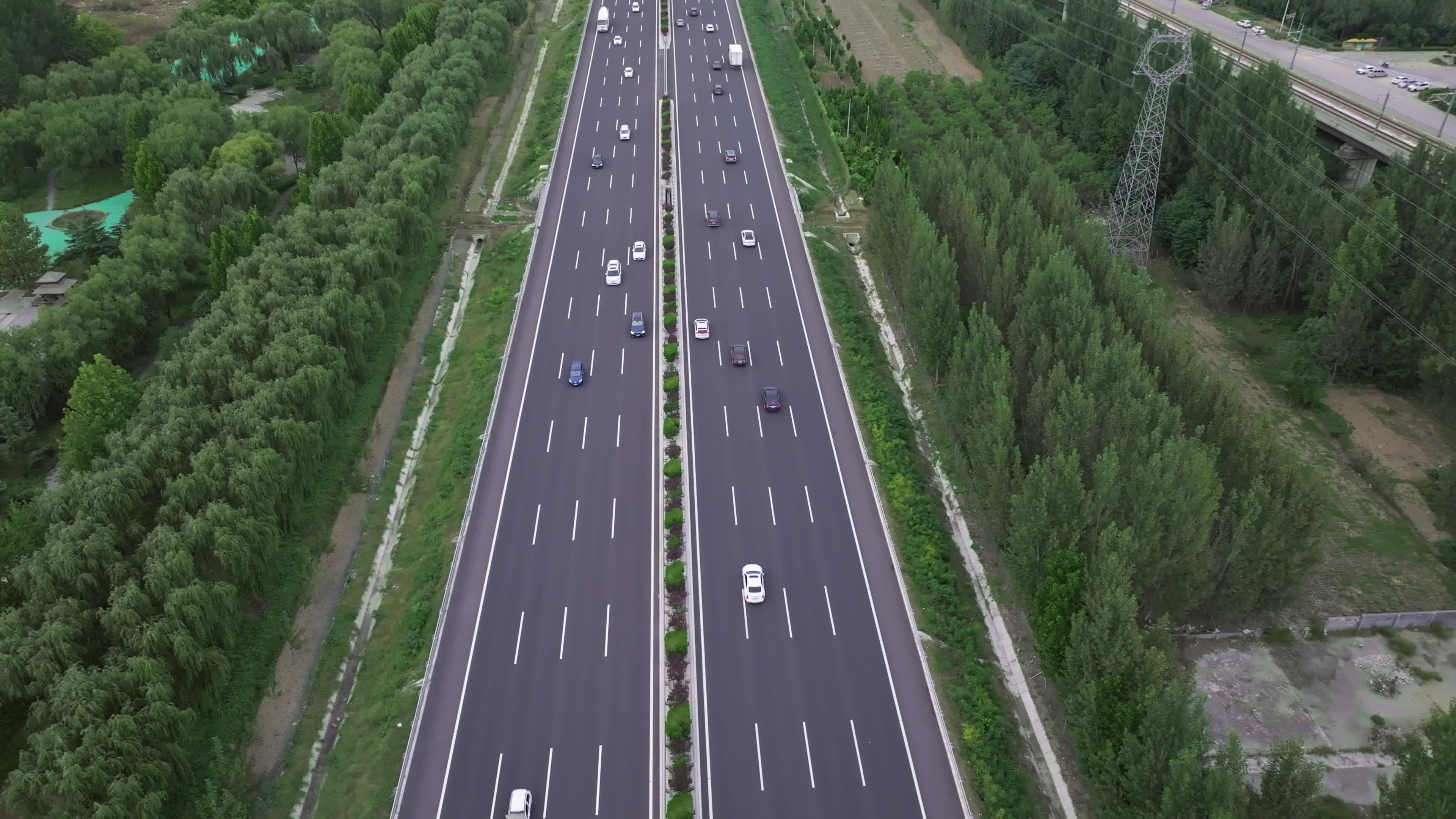 Aerial video of cars speeding up on the highway