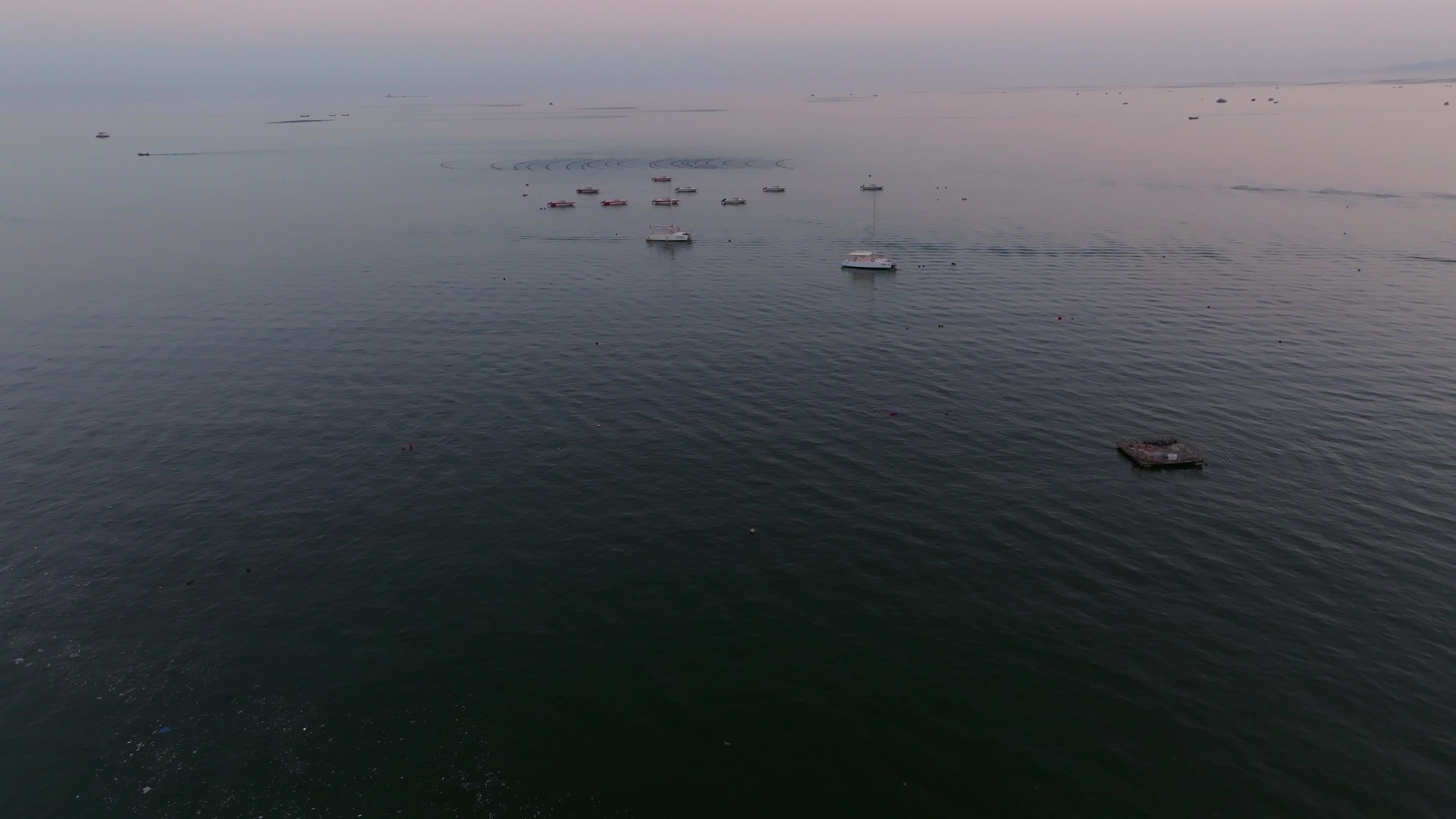 Aerial video of the calm sea surface early in the morning