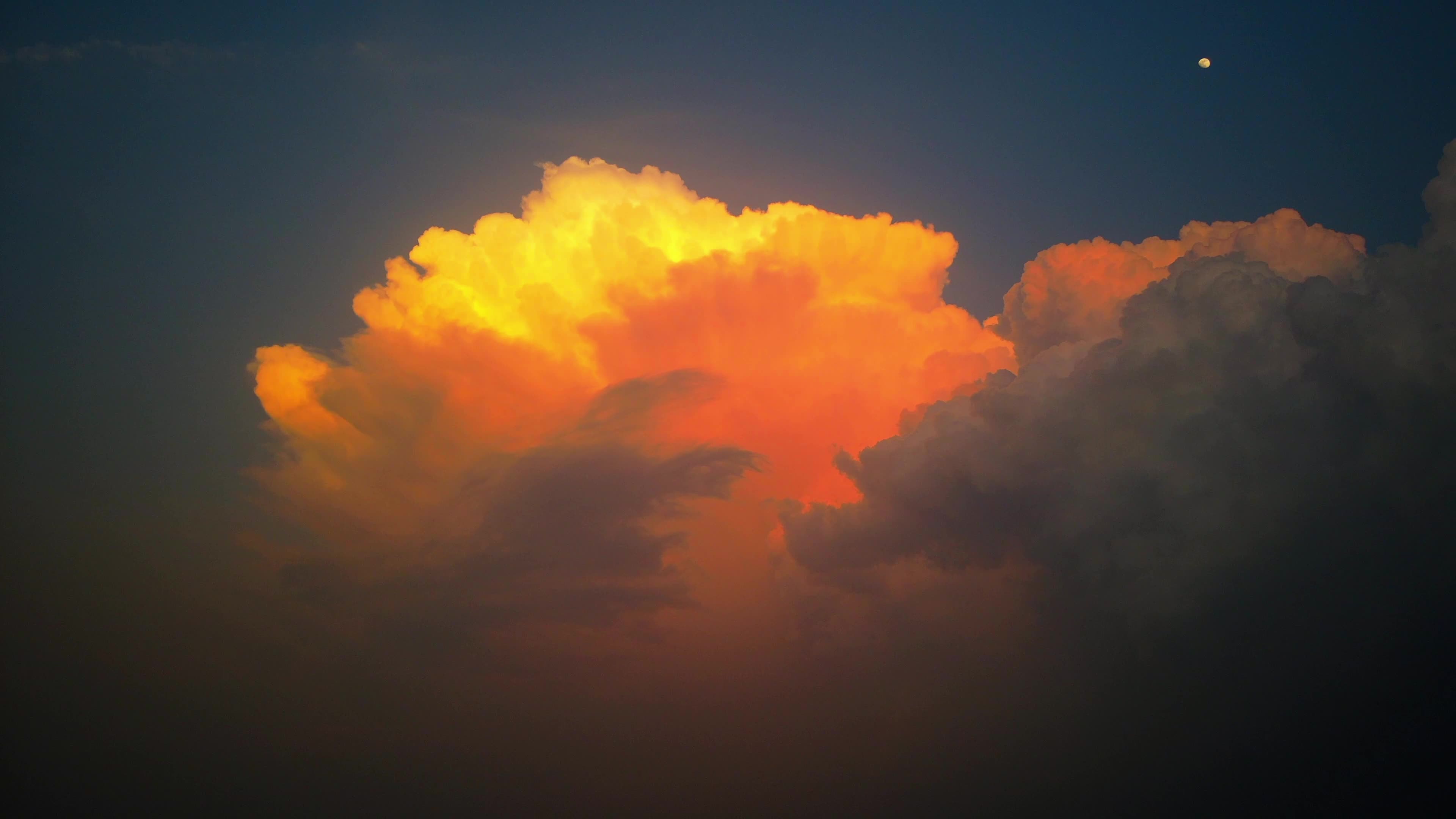 A large cloud formed a sunset glow on the distance